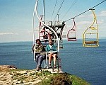 Leader Liz (right)
      on a chair lift near the Needles on the Isle of Wight